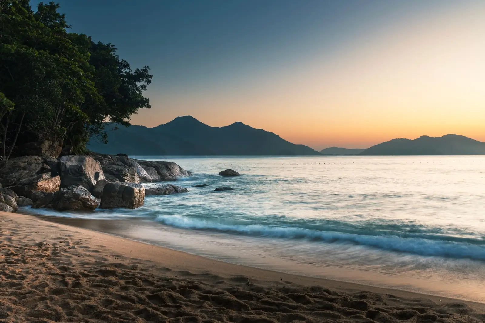 Calm ocean coastline at sunrise, a symbol of hope and new beginnings